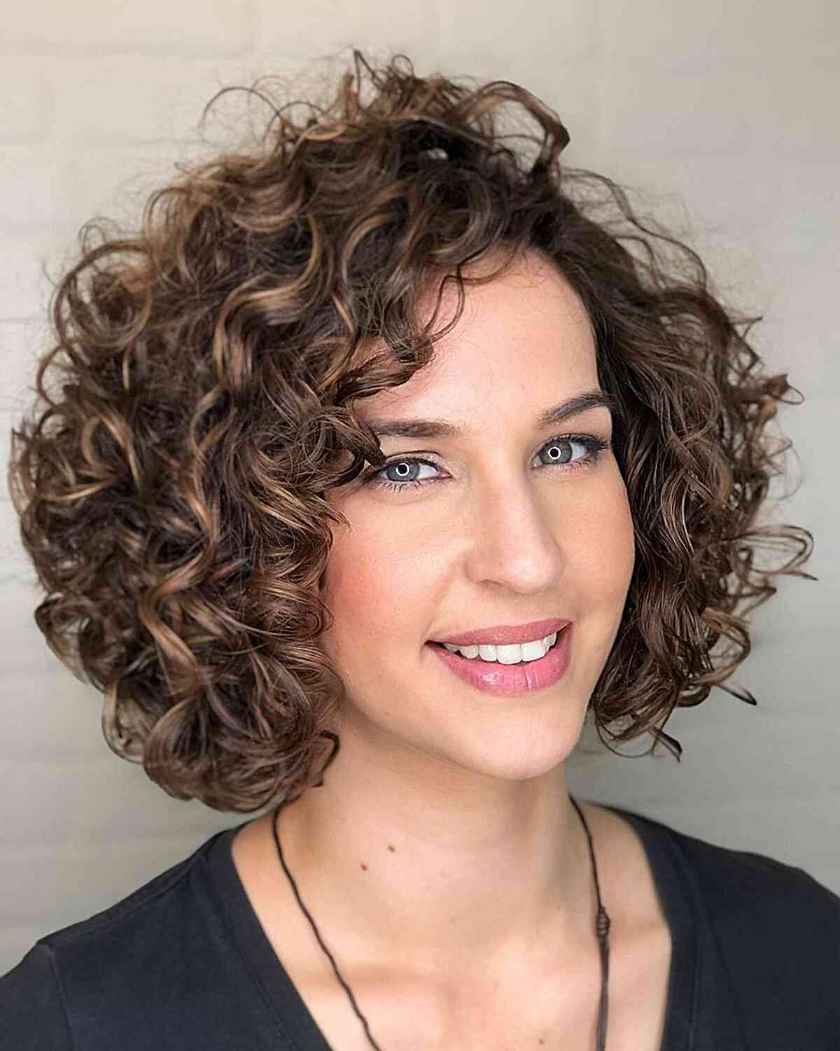 22 Short Curly Hairstyles That Nail the Volume + Shape Combo