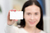 Woman Holding a Business Card PSD Mockup in a Hand