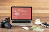 Front View Of Photographer Wooden Workspace With Laptop Psd