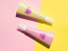 Product Design With Pink Bottles Mock-Up On Bicolor Background Psd