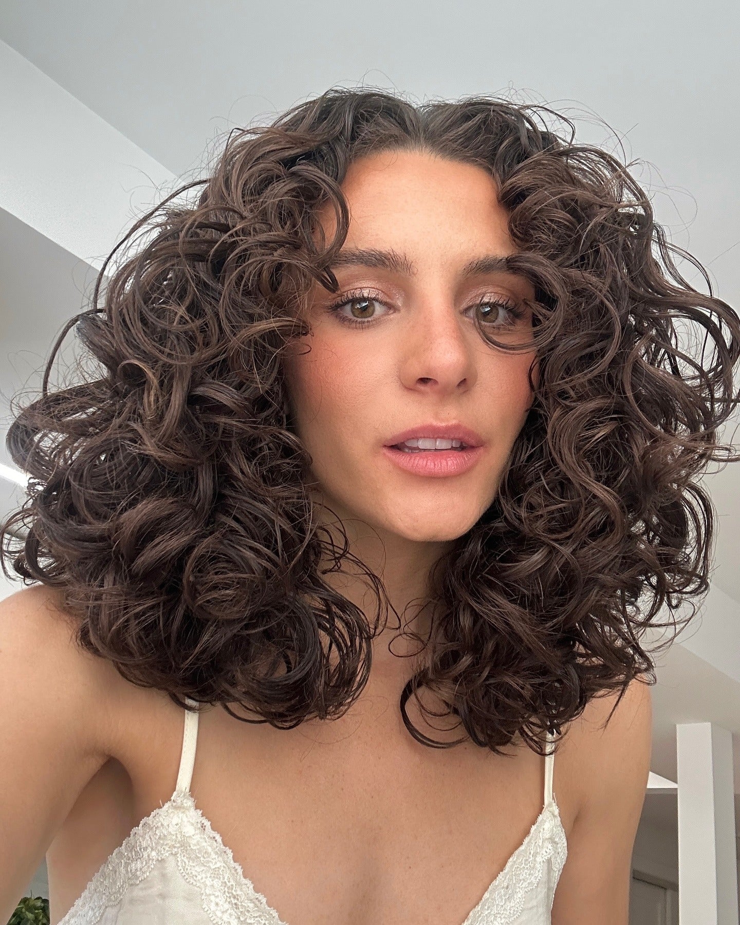 15 Layered Curly Hairstyles Perfect for 2025