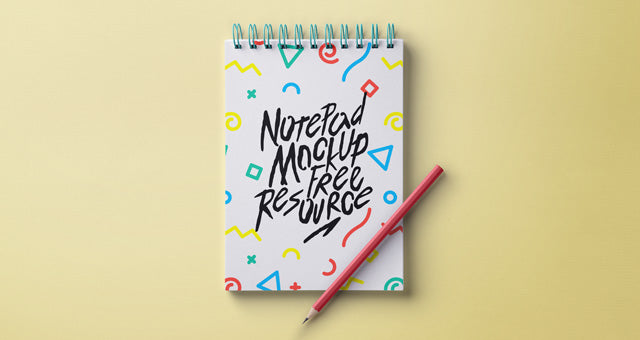 Free Notebook with Pen Mockup (PSD)