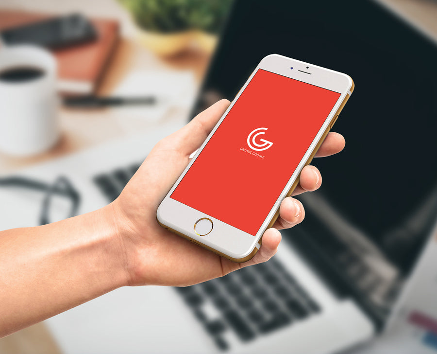 Man Holding iPhone 6 in Office Mockup