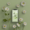 3D Flowers Around Mobile On Table Psd