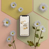 3D Flowers With Mobile On Table Psd