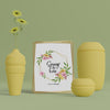 3D Vases And Hello Spring Card On Table Psd
