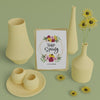 3D Vases And Spring Card On Table Psd