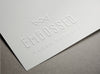 Embossed White Paper Logo PSD MockUp