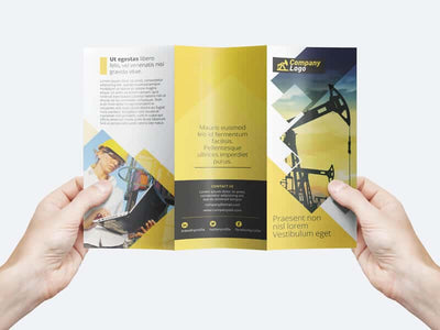 Man Holding a Trifold Flyer Template