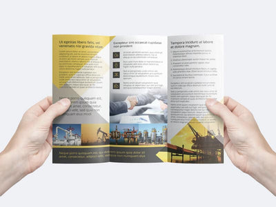 Man Holding a Trifold Flyer Template