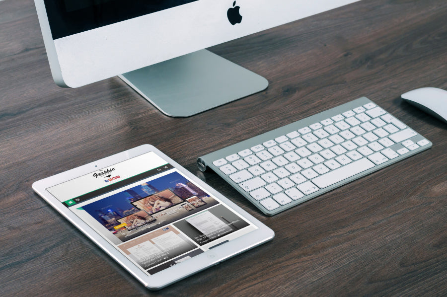 Man or Woman Holding a Set of iPad PSD Mockups