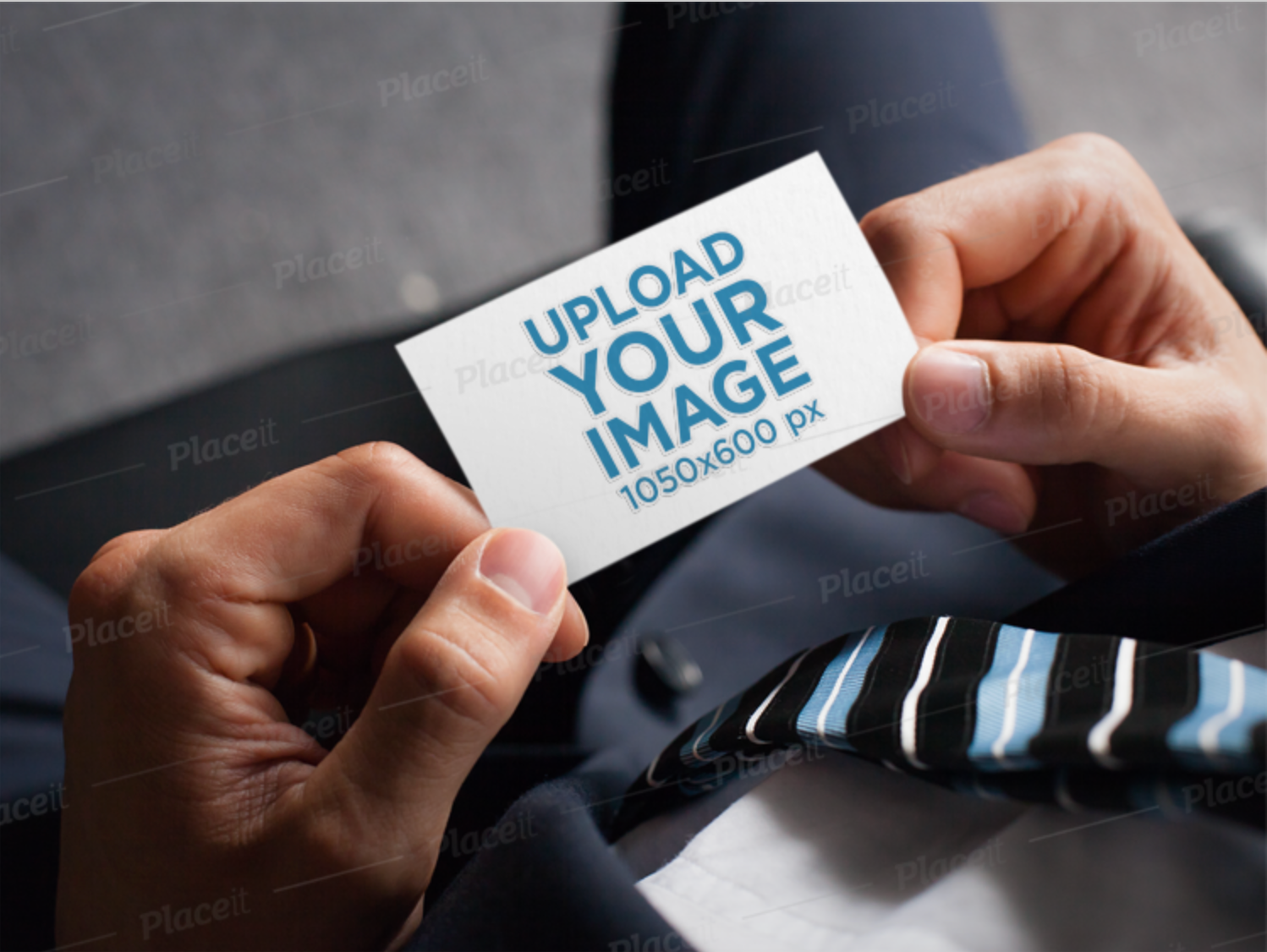 Mockup of a Man Holding a Business Card with an Embossed Texture [Free to Preview]
