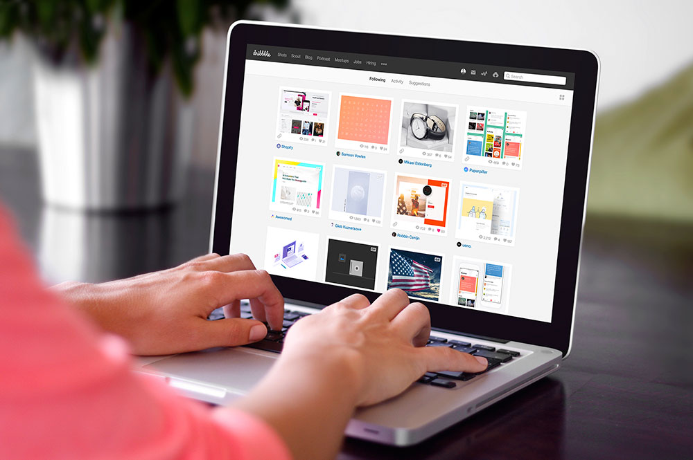 Woman Typing on a Macbook Pro Laptop PSD Mockup