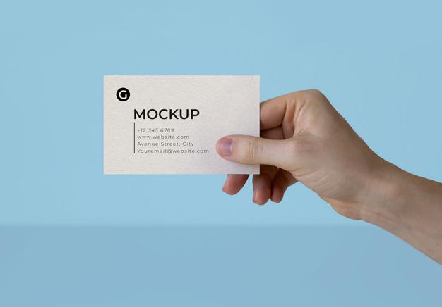 A Hand Holding A Business Card Mockup Psd