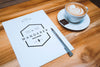 A4 Letterhead and Coffee Cup on Table (Mockup)