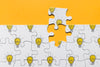 Above View Arrangement With Puzzle On Orange Background Psd