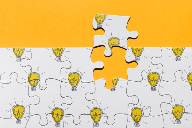 Above View Arrangement With Puzzle On Orange Background Psd