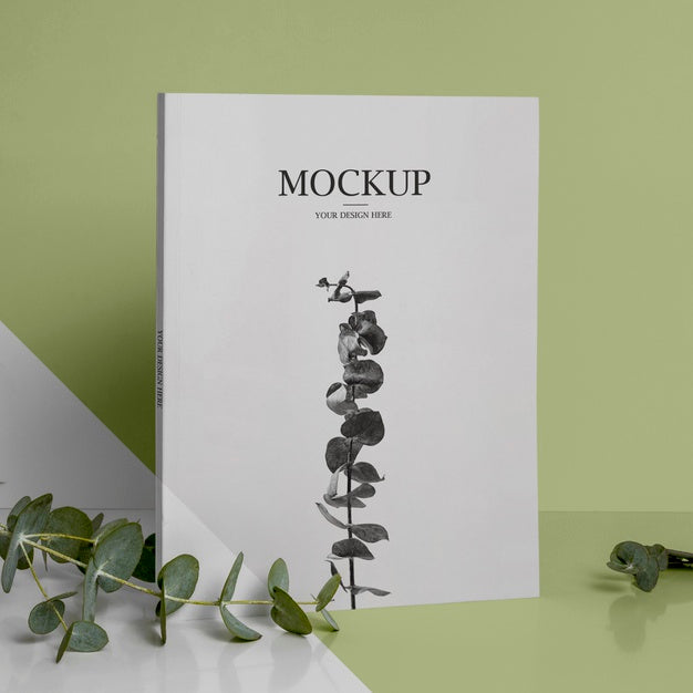 Above View Assortment With Magazine And Leaves Psd