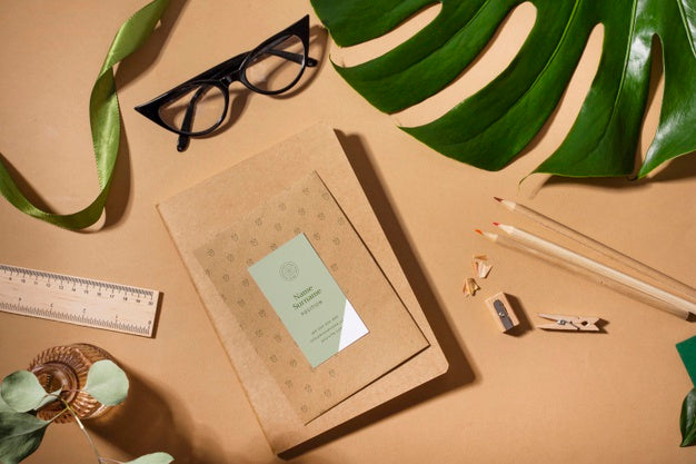 Above View Notebook And Monstera Plant Psd