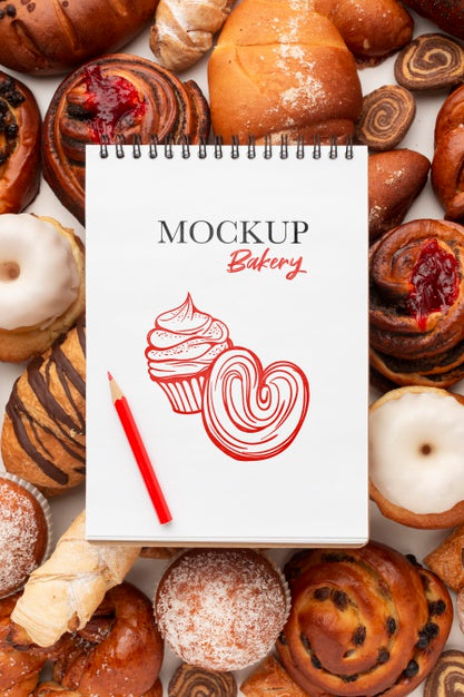 Above View Pastry Arrangement With Notebook Psd