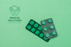 Above View Pills On Green Background Psd