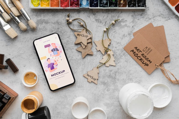 Acrylic Palette And Brushes Beside Mobile Psd