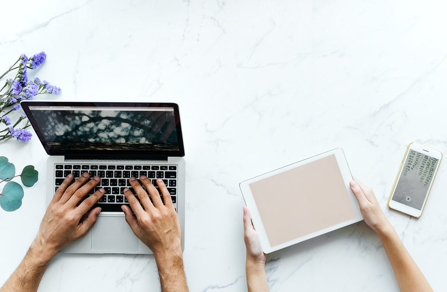 Aerial View Of A Couple Using Digital Devices
