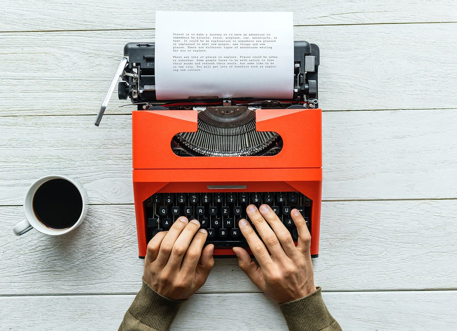 Aerial View Of A Man Typing On A Retro Typewriter