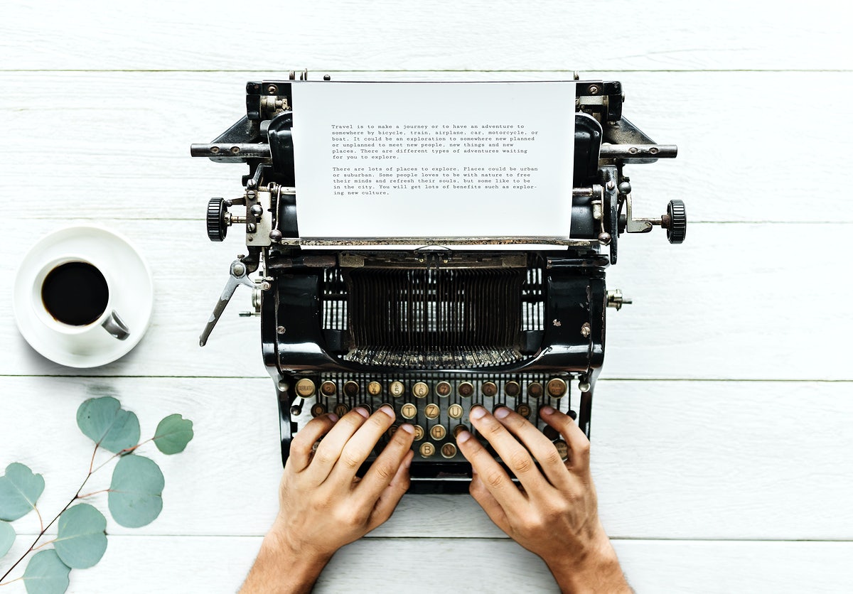 Aerial View Of A Man Typing On A Retro Typewriter