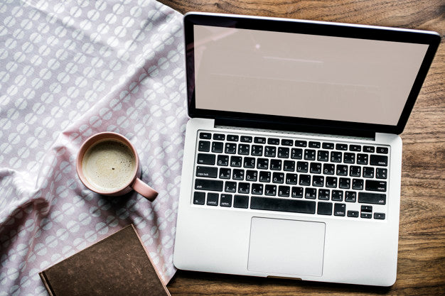 Aerial View Of Computer Laptop On Wooden Table And A Cup Of Hot Milk Psd