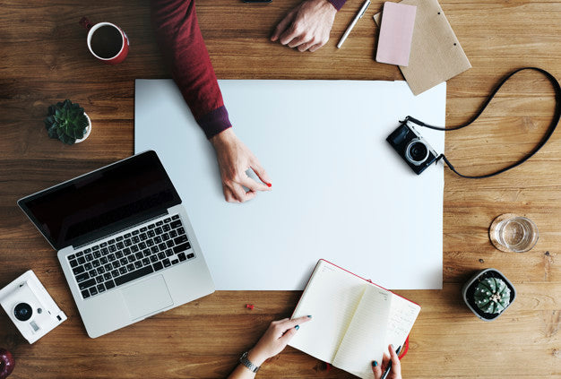 Aerial View Of Hands Planning A Trip With Design Space Psd