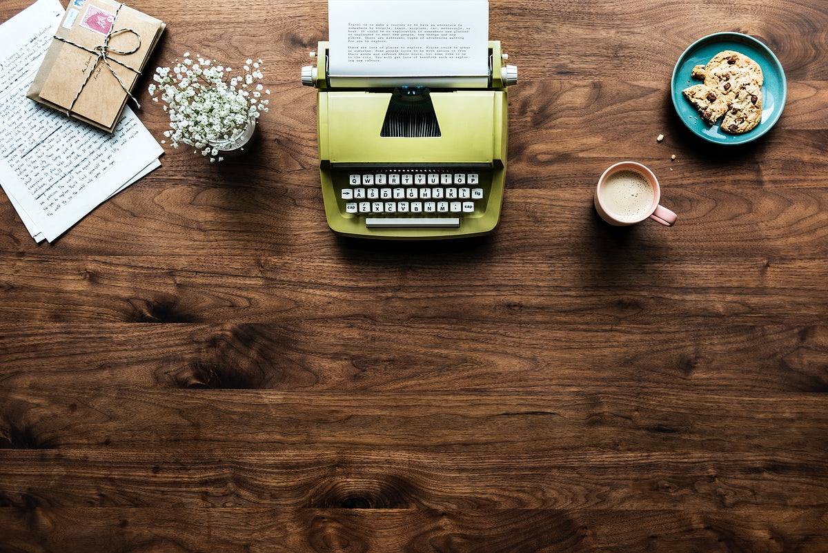 Aerial View Of Retro Typewriter Workspace Concept And Copy Space