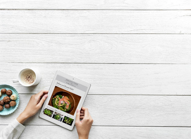 Aerial View Of Woman Using A Digital Tablet With Design Space Hobby Concept Psd