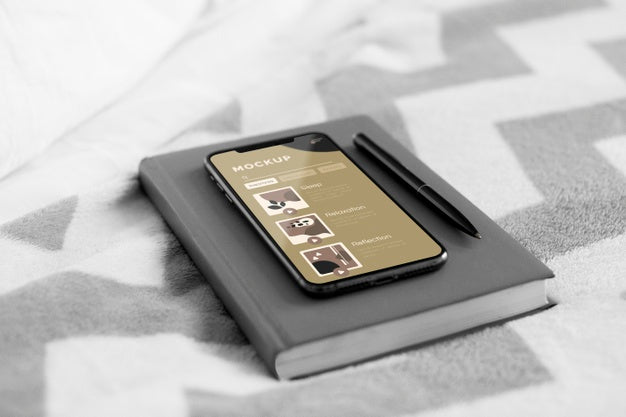 Agenda And Mobile On Bed Psd