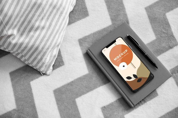 Agenda And Mobile On Bed Psd