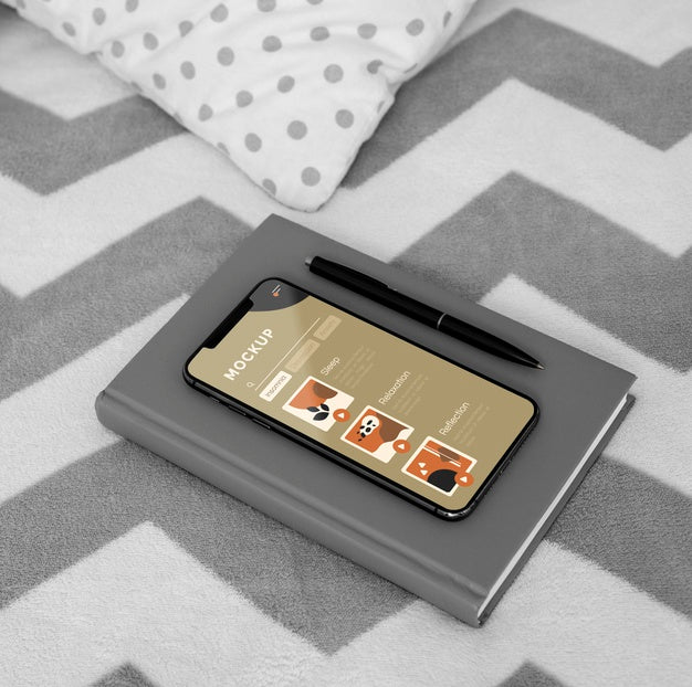 Agenda And Mobile On Bed Psd