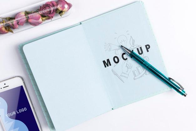 Agenda And Smartphone On Desk At Office Psd