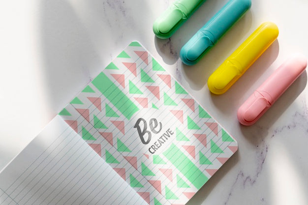 Agenda With Markers Beside On Desk Psd