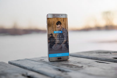 Android Smart Phone Mockup on a Wooden Table Outdoors