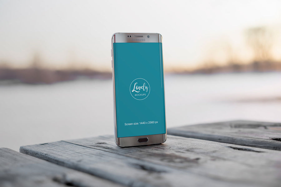 Android Smart Phone Mockup on a Wooden Table Outdoors