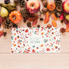 Apples And Pine Cones With Colourful Card Psd