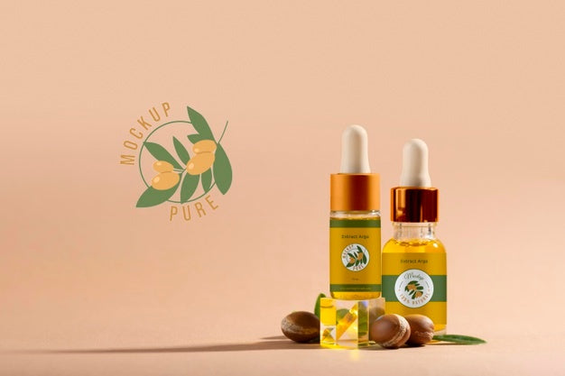 Argan Oil Cosmetic Bottle Mock-Up With Kernels And Dropper Psd