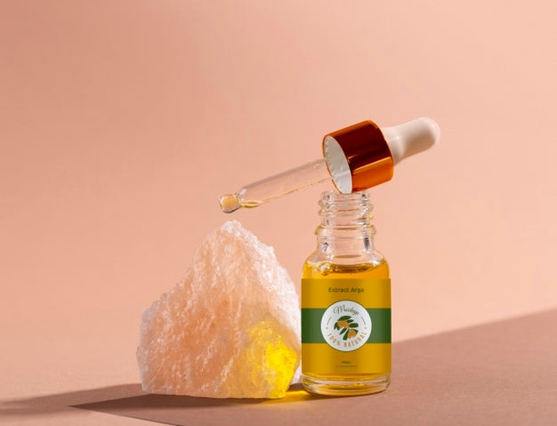 Argan Oil Cosmetic Bottle Mock-Up With Rock Psd