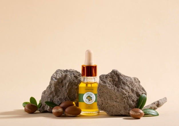 Argan Oil Cosmetic Bottle Mock-Up With Rock Psd