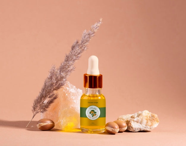 Argan Oil Cosmetic Bottle Mock-Up With Rock Psd