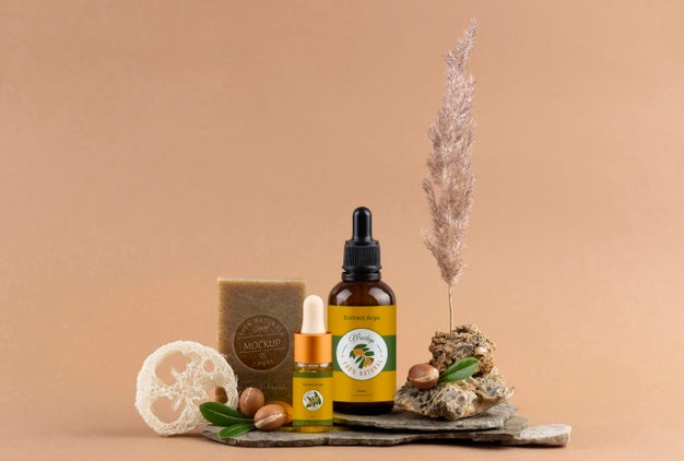Argan Oil Cosmetic Bottle Mock-Up With Soap Bar And Kernels Psd