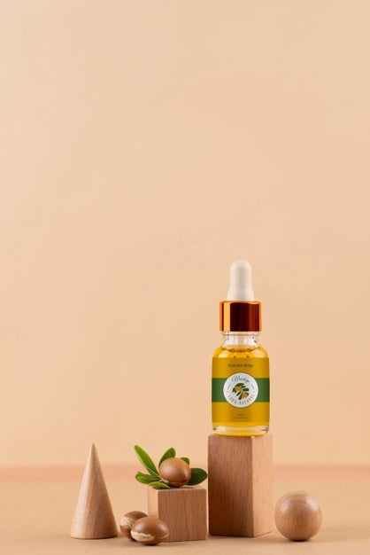 Argan Oil Cosmetic Bottle Mock-Up With Wooden-Shaped Podium And Kernels Psd