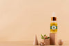 Argan Oil Cosmetic Bottle Mock-Up With Wooden-Shaped Podium And Kernels Psd