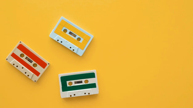Arrangement Of Music Cassettes On Yellow Background Psd