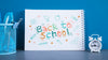 Arrangement With Back To School Lettering On Notebook Psd